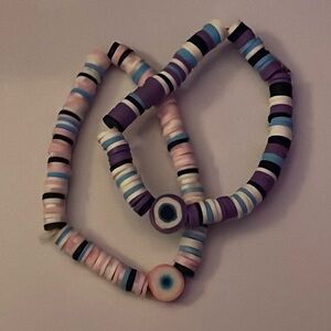 Matching purple and pink evil eye clay bead bracelets